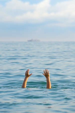 The drowning man. The man in water asks about the help.の写真素材