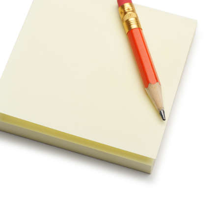 Paper note and a red pencil. It is isolated on a white backgroundの写真素材