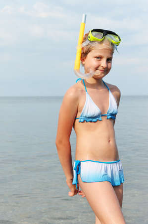 The girl on seacoast. In a mask, and with a snorkelの写真素材