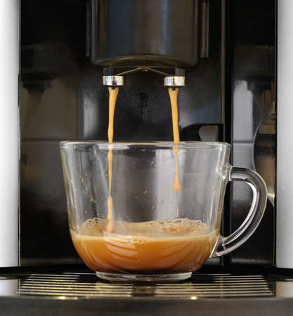 coffee machine. Process of preparation of an espresso. Photo on long exposure.の写真素材