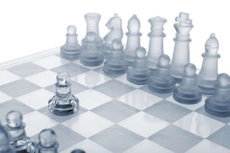 Glass chess. The first move. Blue toned.の写真素材
