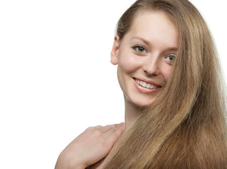 The beautiful girl with long healthy hair. It is isolated on a white backgroundの写真素材
