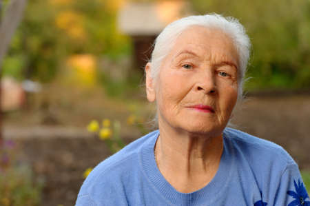 Portrait of the elderly woman. A photo on outdoorsの写真素材