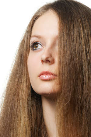 The beautiful girl with long healthy hair. It is isolated on a white backgroundの写真素材