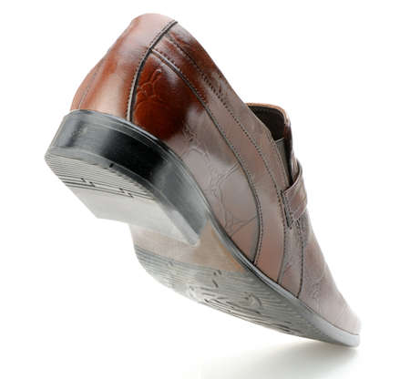 Man's shoes. The rear view. A red skin. It is isolated on a white backgroundの写真素材