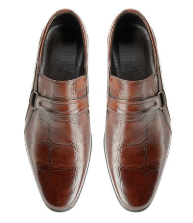 Pair of man's shoes. A red skin. It is isolated on a white backgroundの写真素材