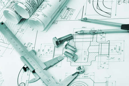 The plan industrial details, a screws, caliper, divider. A photo closeup. Blue toning