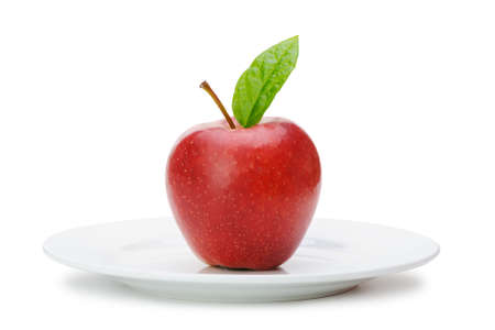 Red apple on plate. Isolated on white backgroundの写真素材