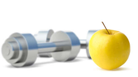 Dumbbells with an apple. Dumbbells blured on a background. It is isolated on a white backgroundの写真素材