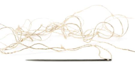 Needle and thread closeup. Isolated on white backgroundの写真素材