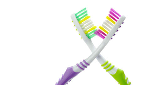Two color toothbrushes . Photo closeup. Isolated on white backgroundの写真素材