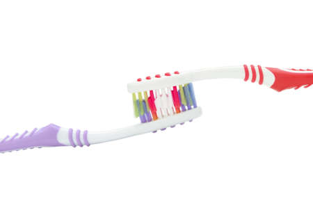 Two color toothbrushes . Photo closeup. Isolated on white backgroundの写真素材