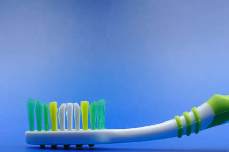 Toothbrush on a blue background . Photo closeup.の写真素材