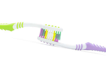 Two color toothbrushes . Photo closeup. Isolated on white backgroundの写真素材