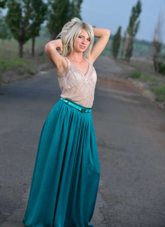 Portrait of a pretty woman standing on the road. Shooting outdoorsの写真素材