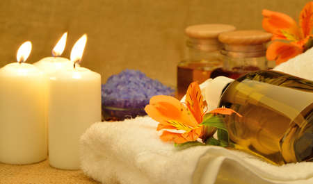 Object for the spa. Candles burning, pebble, a Lily, a bottle with oil, liquid soap, and more.の写真素材