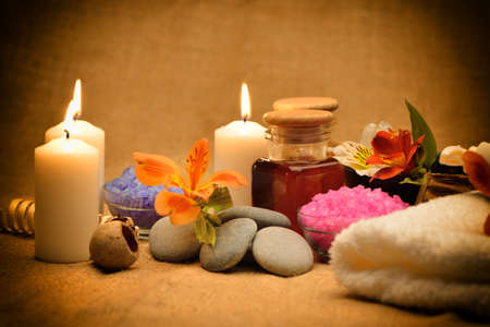 Object for the spa. Candles burning, pebble, a Lily, a bottle with oil, liquid soap, and more.の写真素材