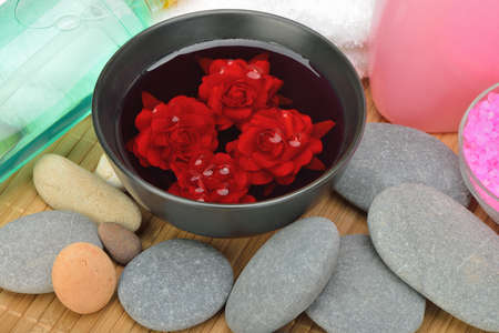 Object for the spa. Pebble, Lily, liquid soap, bowl with roses in water.の写真素材