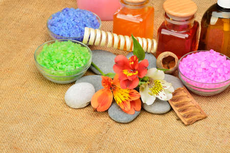 Object for the spa. Pebble, Lily, liquid soap, cupping glass with butter and another.の写真素材