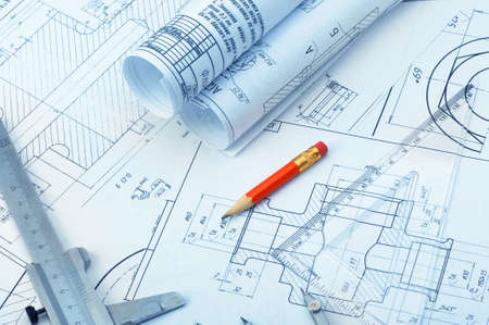 The plan industrial details, a ruler, caliper, divider and a red pencil. A photo closeup. Blue toningのeditorial素材