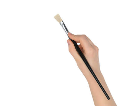 Hand with a brush. It is isolated on a white background. Drawing imitationの写真素材