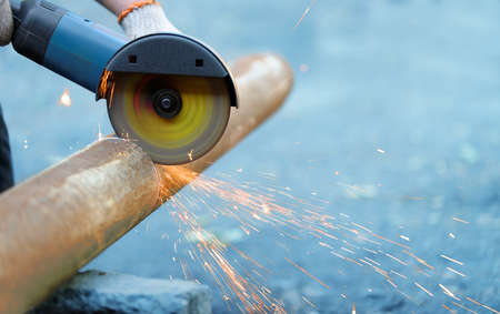 Cutting metal  angle grinder, sparks from the disk. Photo close-upの写真素材