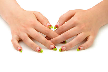 Female hands with manicure closeup. Isolated on white. Drawing red poppy flowers.の写真素材