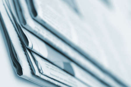 Heap of newspapers. Blue toned. A photo close up. Selective focusの写真素材