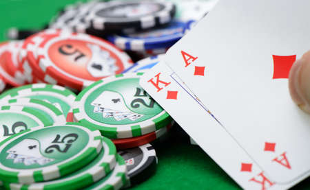 Gaming cards  in hand on the green cloth. A winning combination in Black Jackの写真素材