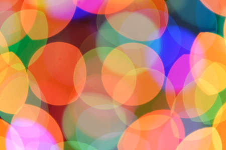 Defocused color background. Blurring the image colourful festive lights Defocused color background. Blurring the image colourful festive lights
