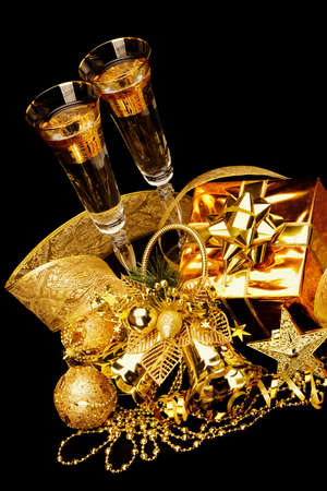 Gold Christmas decorations. Boxes, ribbons, stars, bells on black backgroundの写真素材
