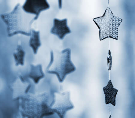 Garland of stars blue toned. Very blurred backgroundの写真素材