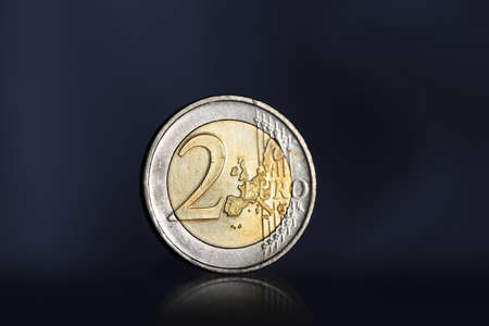 Two euro coin. Dark background with backlightの写真素材
