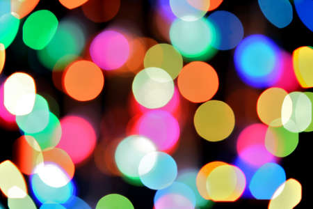 Defocused color background. Blurring the image colourful festive lightsの写真素材