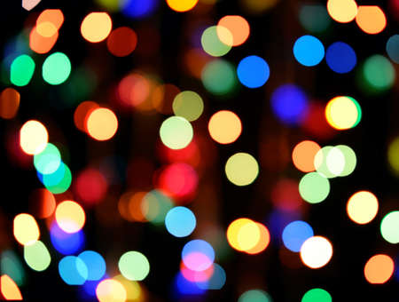 Defocused color background. Blurring the image colourful festive lightsの写真素材