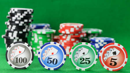 Gaming chips on the green cloth. High detailed photoの写真素材