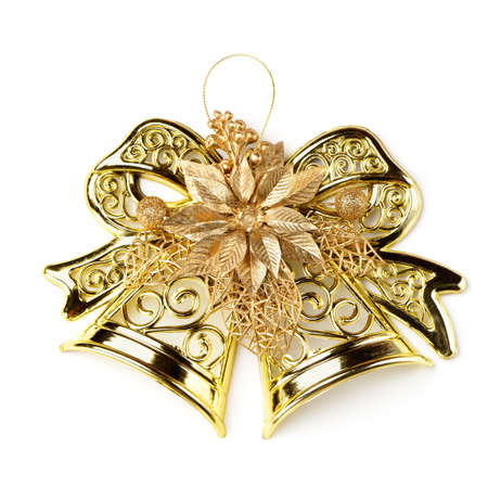 Golden bell with a holiday ornament. Isolated on white backgroundの写真素材