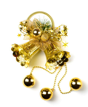 Golden bell with a holiday ornament. Isolated on white backgroundの写真素材