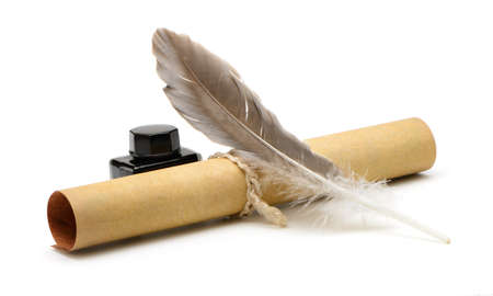 A feather pen, ink,rolls of old yellowed paper. Isolated on a white background.の写真素材