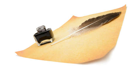 Feather pen on the old yellowed paper. Isolated on a white background.の写真素材