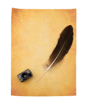Feather pen on the old yellowed paper. Isolated on a white background.の写真素材