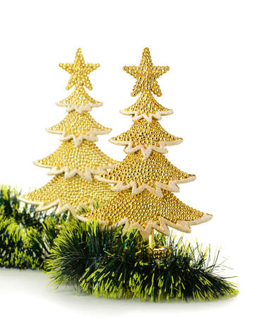gold decorated Christmas trees and holiday object. Isolated on whiteの写真素材