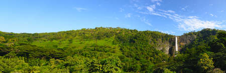 The waterfall panoramic photo. The waterfall with the mountains in the country of Sri Lankaの写真素材