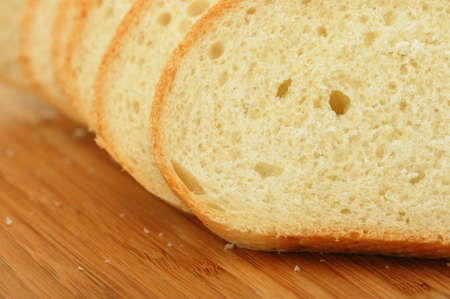 The cut bread on a chopping board. Photo closeup