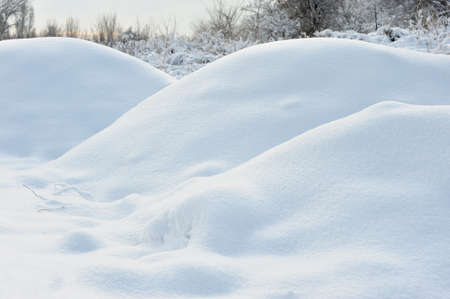 Winter landscape. Frosty weather, snowdrifts in the foreground
