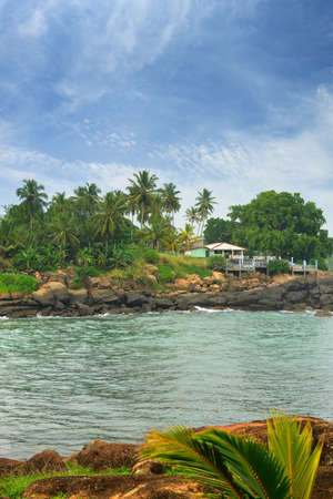 The coast of the Indian ocean. Cafe , palm trees, stones. Sri Lankaの写真素材