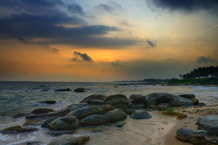 Coast of the Indian ocean. Sunset, stone. Sri Lankaの写真素材