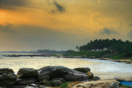 Coast of the Indian ocean. Sunset, stone. Sri Lankaの写真素材