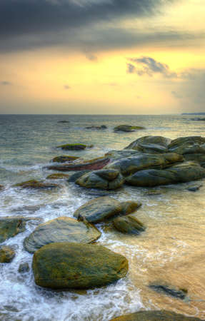 Coast of the Indian ocean. Sunset, stone. Sri Lankaの写真素材