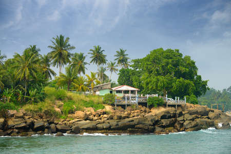 The coast of the Indian ocean. Cafe , palm trees, stones. Sri Lankaの写真素材